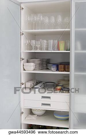 Crockery in a kitchen shelf View Large Photo Image Stock Photograph - Crockery in a kitchen shelf. Fotosearch