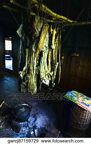 Dried fish hanging in a traditional kitchen, Jinkeng Terraced Field, Guangxi Province, China View Large Photo Image Stock Photo - Dried fish hanging in a traditional kitchen, Jinkeng Terraced Field, Guangxi Province, China. Fotosearch