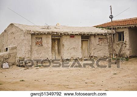 Stock Image - Facade of a mud hut, Inner Mongolia, China. Fotosearch