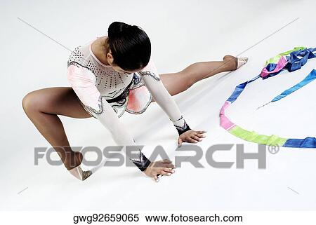 Female gymnast practicing View Large Photo Image Stock Photography - Female gymnast practicing. Fotosearch