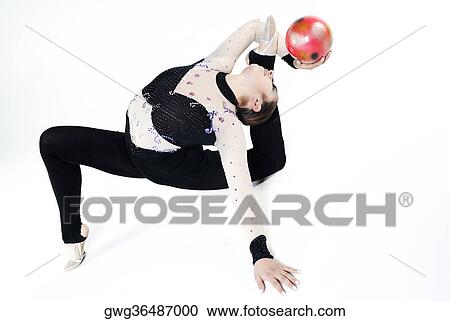 Female gymnast practicing with a ball View Large Photo Image Stock Image - Female gymnast practicing with a ball. Fotosearch