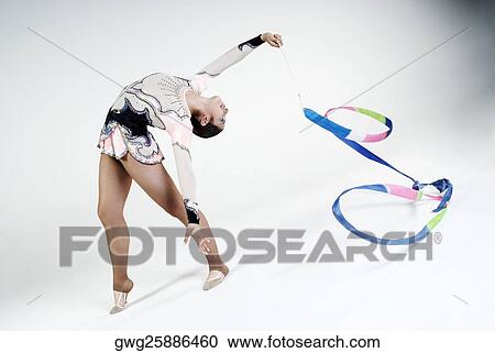 Female gymnast practicing with a ribbon View Large Photo Image Stock Image - Female gymnast practicing with a ribbon. Fotosearch
