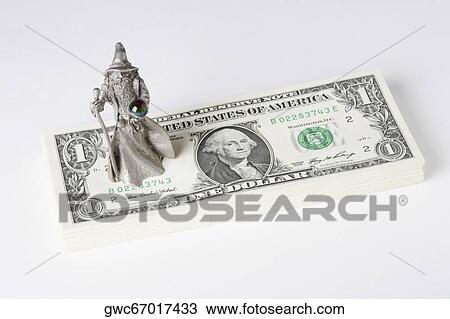 Figurine of a fortune teller on US paper currency View Large Photo Image Stock Image - Figurine of a fortune teller on US paper currency. Fotosearch