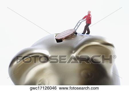 Figurine of a man putting a coin into a piggy bank View Large Photo Image Stock Photograph - Figurine of a man putting a coin into a piggy bank. Fotosearch