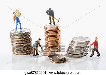 Stock Image - Figurines of manual workers with stacks of coins. Fotosearch