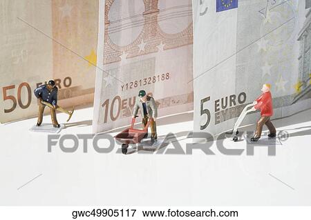 Figurines of manual workers with European union banknotes View Large Photo Image Stock Photo - Figurines of manual workers with European union banknotes. Fotosearch
