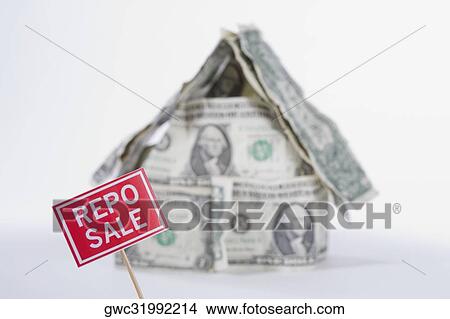 For Sale board in front of a miniature house made up of US dollar bills View Large Photo Image Picture - For Sale board in front of a miniature house made up of US dollar bills. Fotosearch
