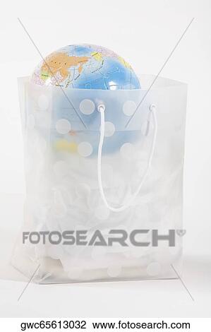 Globe in a transparent shopping bag View Large Photo Image Stock Image - Globe in a transparent shopping bag. Fotosearch