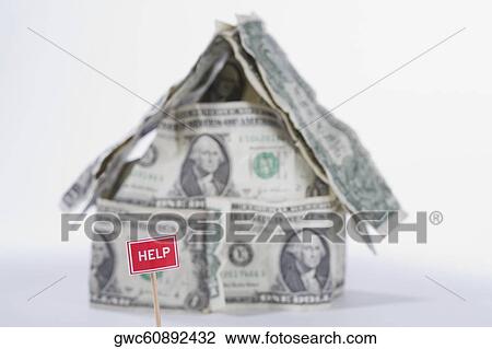 Help sign board in front of a miniature house made by US dollar bills View Large Photo Image Stock Image - Help sign board in front of a miniature house made by US dollar bills. Fotosearch