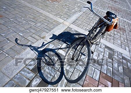 Stock Image - High angle view of a bicycle, Guan Yin Si, HohHot, Inner Mongolia, China. Fotosearch