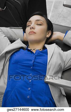 High angle view of a businesswoman sleeping at an airport View Large Photo Image Stock Image - High angle view of a businesswoman sleeping at an airport. Fotosearch