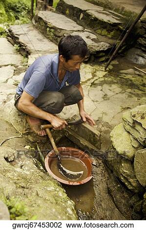 High angle view of a mature man sharpening a sickle, Jinkeng Terraced Field, Guangxi Province, China View Large Photo Image Stock Image - High angle view of a mature man sharpening a sickle, Jinkeng Terraced Field, Guangxi Province, China. Fotosearch