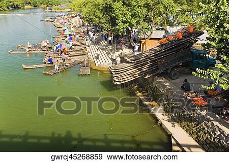 Stock Photo - High angle view of bamboo rafts at a riverbank, XingPing, Yangshuo, Guangxi Province, China. Fotosearch