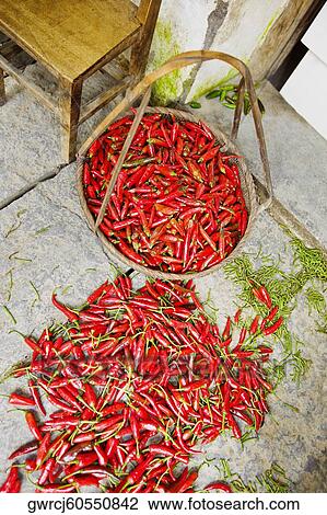 Stock Image - High angle view of red chili peppers, Yangshuo, Guangxi Province, China. Fotosearch