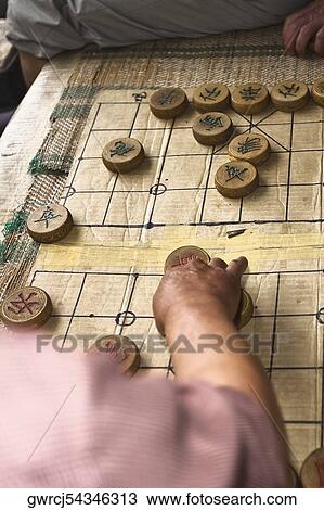 High angle view of two people playing chess, Beidaihe, China View Large Photo Image Stock Image - High angle view of two people playing chess, Beidaihe, China. Fotosearch