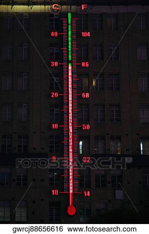 Stock Photograph - Illuminated thermometer neon on a building, Nanjing Road, Shanghai, China. Fotosearch