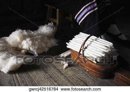 Picture - Incense sticks in a basket with cotton on a wooden plank, Yangshuo, Guangxi Province, China. Fotosearch