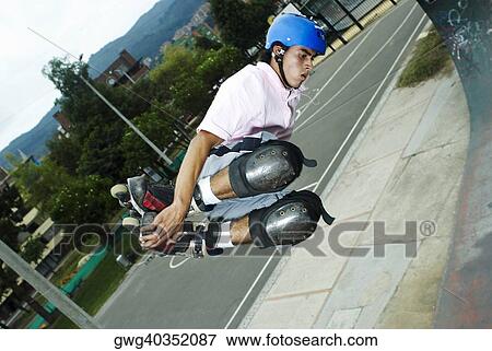 Inline skater jumping in mid-air View Large Photo Image Stock Photo - Inline skater jumping in mid-air. Fotosearch
