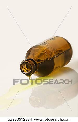 Picture - Liquid coming out of a bottle. Fotosearch