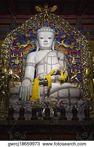 Low angle view of a statue of Buddha, Da Zhao Temple, Hohhot, Inner Mongolia, China View Large Photo Image Stock Image - Low angle view of a statue of Buddha, Da Zhao Temple, Hohhot, Inner Mongolia, China. Fotosearch