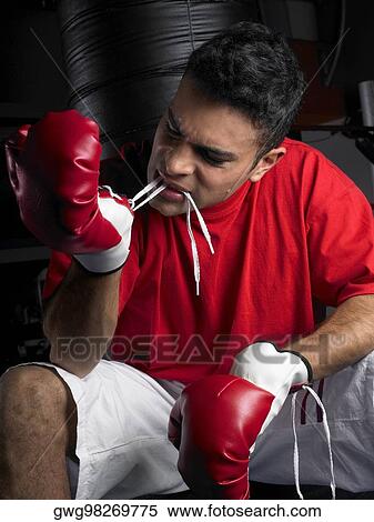 Stock Photography - Male boxer wearing boxing gloves. Fotosearch