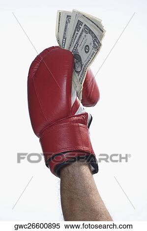 Male boxer's hand holding US dollar bills View Large Photo Image Stock Photography - Male boxer's hand holding US dollar bills. Fotosearch