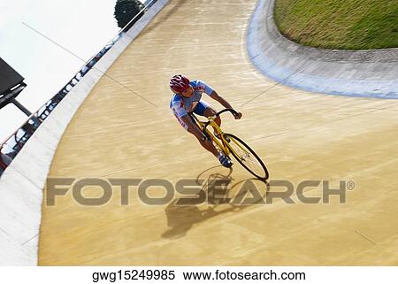 Stock Photography - Man cycling on a sports track. Fotosearch
