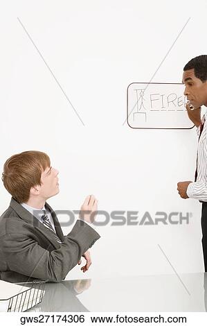Manager sacking an employee View Large Photo Image Stock Photograph - Manager sacking an employee. Fotosearch