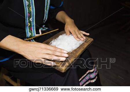 Mid section view of a woman making incense stick, Yangshuo, Guangxi Province, China View Large Photo Image Stock Photo - Mid section view of a woman making incense stick, Yangshuo, Guangxi Province, China. Fotosearch