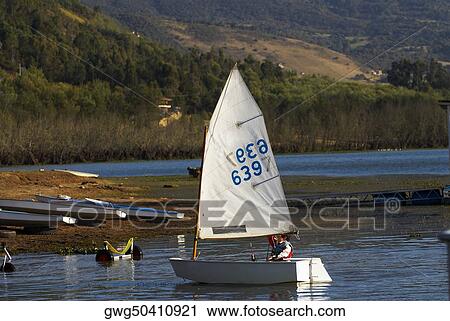 Person participating in a sailboat race View Large Photo Image Stock Image - Person participating in a sailboat race. Fotosearch
