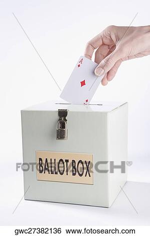 Person's hand inserting a playing card into a ballot box View Large Photo Image Stock Photograph - Person's hand inserting a playing card into a ballot box. Fotosearch