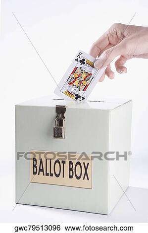 Person's hand inserting a playing card into a ballot box View Large Photo Image Stock Photograph - Person's hand inserting a playing card into a ballot box. Fotosearch