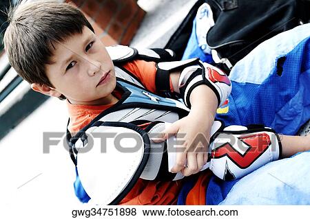 Portrait of a boy getting dressed for ice hockey View Large Photo Image Stock Photo - Portrait of a boy getting dressed for ice hockey. Fotosearch