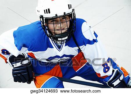 Portrait of a boy playing ice hockey View Large Photo Image Stock Image - Portrait of a boy playing ice hockey. Fotosearch