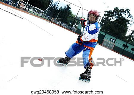 Stock Photo - Portrait of a boy playing ice hockey. Fotosearch