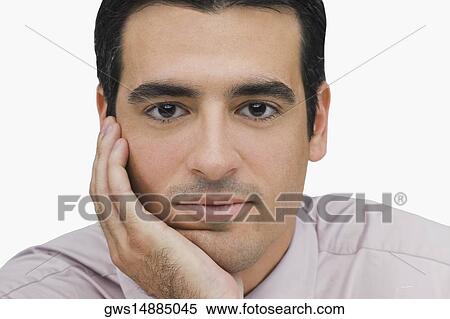 Portrait of a businessman thinking with his hand on his chin View Large Photo Image Stock Photography - Portrait of a businessman thinking with his hand on his chin. Fotosearch