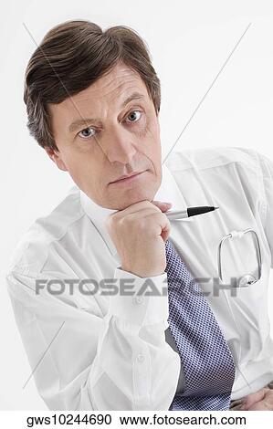 Portrait of a male doctor looking worried View Large Photo Image Stock Image - Portrait of a male doctor looking worried. Fotosearch