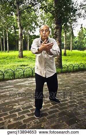 Portrait of a senior man practicing kung fu, Temple Of Heaven, Beijing, China View Large Photo Image Stock Image - Portrait of a senior man practicing kung fu, Temple Of Heaven, Beijing, China. Fotosearch