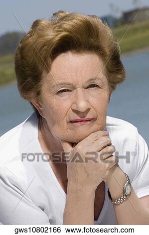 Stock Photograph - Portrait of a senior woman thinking. Fotosearch