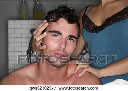 Portrait of a young man and his wife in the bathroom View Large Photo Image Stock Photo - Portrait of a young man and his wife in the bathroom. Fotosearch