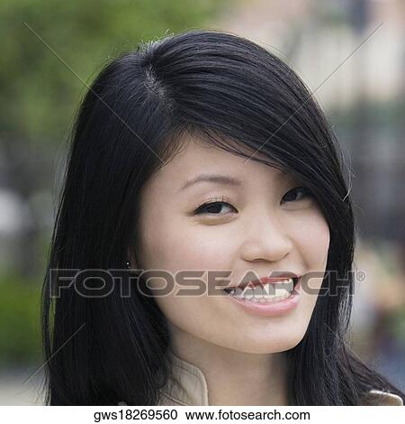 Portrait of a young woman smiling View Large Photo Image Stock Image - Portrait of a young woman smiling. Fotosearch
