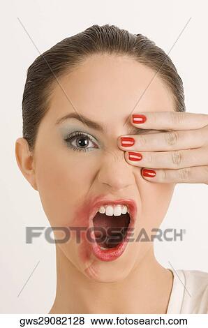 Portrait of a young woman with her messy lips View Large Photo Image Stock Photo - Portrait of a young woman with her messy lips. Fotosearch