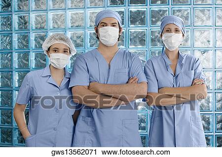 Stock Image - Portrait of three surgeons. Fotosearch