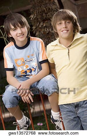 Portrait of two schoolboys smiling together View Large Photo Image Stock Photo - Portrait of two schoolboys smiling together. Fotosearch