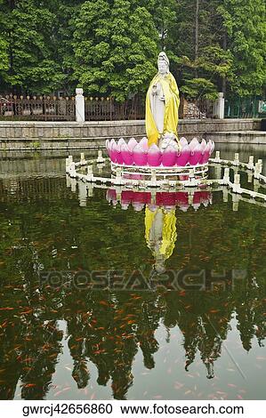 Reflection of statue and trees in water, Zhanshan Temple, Qingdao, Shandong Province, China View Large Photo Image Stock Image - Reflection of statue and trees in water, Zhanshan Temple, Qingdao, Shandong Province, China. Fotosearch