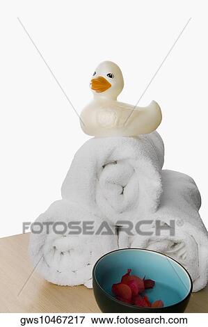 Rubber duck on the stack of rolled up towels View Large Photo Image Stock Photo - Rubber duck on the stack of rolled up towels. Fotosearch
