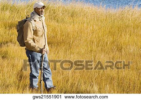 Side profile of a mature man hiking View Large Photo Image Stock Image - Side profile of a mature man hiking. Fotosearch