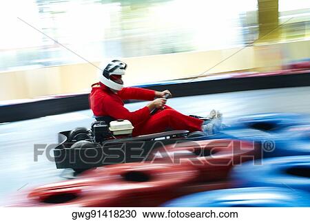 Side profile of a person go-carting on a motor racing track View Large Photo Image Stock Image - Side profile of a person go-carting on a motor racing track. Fotosearch