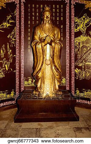 Stock Image - Statue of God in a temple, Songyang Academy, Shaolin Monastery, Henan Province, China. Fotosearch