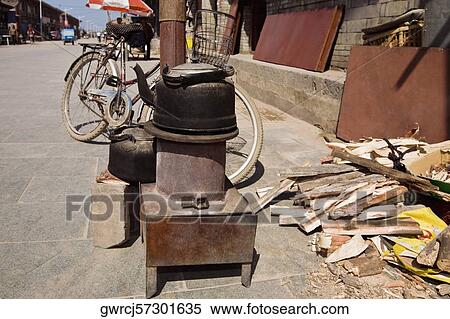 Traditional stove and a kettle at the roadside, HohHot, Inner Mongolia, China View Large Photo Image Stock Photography - Traditional stove and a kettle at the roadside, HohHot, Inner Mongolia, China. Fotosearch